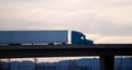 Modern semi truck trailer on overpass bridge evening silhouette Royalty Free Stock Photo