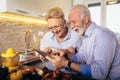 Senior couple shopping online with tablet and credit card Royalty Free Stock Photo