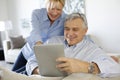 Modern senior couple with tablet Royalty Free Stock Photo