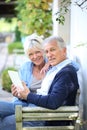 Modern senior couple using tablet outdoors Royalty Free Stock Photo