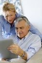 Modern senior couple using tablet Royalty Free Stock Photo