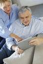 Modern senior couple using tablet Royalty Free Stock Photo