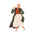 Modern senior woman dancing, going. Happy old grandmother in fashion apparel, sneakers. Active gray-haired elder lady