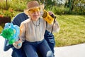 Modern Senior woman have fun playing with  water gun Royalty Free Stock Photo