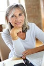 Modern senior woman using laptop at home Royalty Free Stock Photo