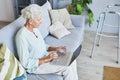 Modern Senior Woman Using Laptop at Home Royalty Free Stock Photo