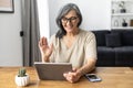 Modern senior woman using a tablet Royalty Free Stock Photo