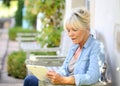 Modern senior woman using tablet Royalty Free Stock Photo