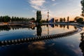 Modern sewage treatment plant. Round wastewater purification tank at sunset