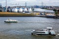 Modern Sewage Treatment Plant on the shore of the River Elbe with ferries in foreground in Hamburg, Germany