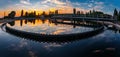 Modern sewage treatment plant. Round wastewater purification tanks at sunset