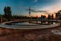 Modern sewage treatment plant. Round wastewater purification tanks at sunset Royalty Free Stock Photo