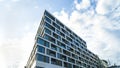 Modern shopping mall and business center outside with many windows against blue sky Royalty Free Stock Photo