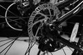 Close-up shot of named mechanic brake disc on bicycle in black and white