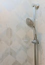 Modern shower head in bathroom with new home construction