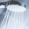 Modern shower head splashing water close up. Royalty Free Stock Photo