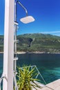 Modern shower on a luxurious beach in a beautiful lagoon on a sunny day.