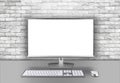 Modern silver black LED computer flat screen display monitor isolated on work desk brick wall background. pc hardware electronics Royalty Free Stock Photo