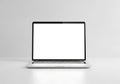 Modern silver laptop computer with blank white screen on a clean white surface Royalty Free Stock Photo