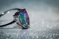 Modern silver ring with mystic topaz