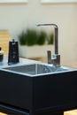 Modern sink and faucet on the kitchen island Royalty Free Stock Photo