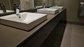 Modern sinks with mirror in public toilet concept Royalty Free Stock Photo