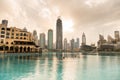 Modern skylines surrouding the Burj Khalifa Lake under the sunset, where water shows performs everynight Royalty Free Stock Photo