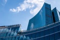 Modern skyscraper with reflections of clouds on windows Royalty Free Stock Photo