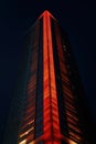 Skyscraper glowing bright red at night Royalty Free Stock Photo