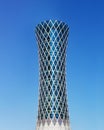 Modern skyscraper Tornado tower in Qatar on blue background