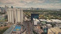 Modern skyscrapers aerial. Epic cityscape with streets along road. Block buildings and cottages