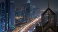 Modern skyscrapers and busy evening highways night timelapse in luxury Dubai city, Dubai, United Arab Emirates Royalty Free Stock Photo