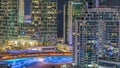 Modern skyscrapers in Dubai Marina, close up view to many illuminated windows aerial night timelapse. Royalty Free Stock Photo