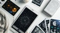 modern, sleek arrangement of astrological tools, including a digital astrology app on a tablet, minimalist tarot cards, and