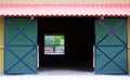 Modern sliding doors at horse stable and riding school in barn at farm