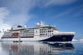 Expedition Ship, Cruiser, Cruise Liner in Antarctica with Zodiacs in front. Hanseatic Nature from Hapag Lloyd Cruises.