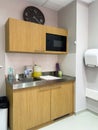 Modern small kitchenette with microwave oven inside