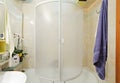 Modern small shower-bath with blue towel Royalty Free Stock Photo