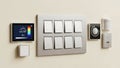 Modern smart home wall panel with multiple control devices and switches Royalty Free Stock Photo