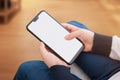 Modern smart phone with round edges and screen tooth in boy hands. Isolated screen for mockup Royalty Free Stock Photo