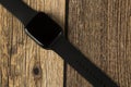 Modern smart watches are multifunctional. Clock on a wooden background Royalty Free Stock Photo
