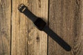 Modern smart watches are multifunctional. Clock on a wooden background Royalty Free Stock Photo