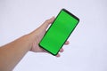 Close-up Smartphone With Green Screen Isolated on a White Background Royalty Free Stock Photo