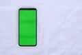 Isolated Close-up Smartphone With Green Screen Isolated on a White Background Royalty Free Stock Photo