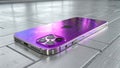 Modern Smartphone with Shiny Purple Metallic Finish on Tile Floor Royalty Free Stock Photo