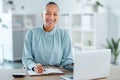 Modern, smiling and young business woman enjoying her work in a office at a computer indoors. Portrait of a happy junior Royalty Free Stock Photo