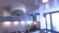 Modern Smoke Detector, Ensuring Home Safety and Security in a Bright Kitchen Interior. Royalty Free Stock Photo