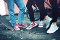 Modern sneakers worn by friends, urban lifestyle of modern clothing and footwear Royalty Free Stock Photo