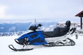 Snowmobile on hill at mountain ski resort