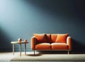 Modern soft orange sofa against a background of an empty blue wall. Minimalist interior of a modern room Royalty Free Stock Photo